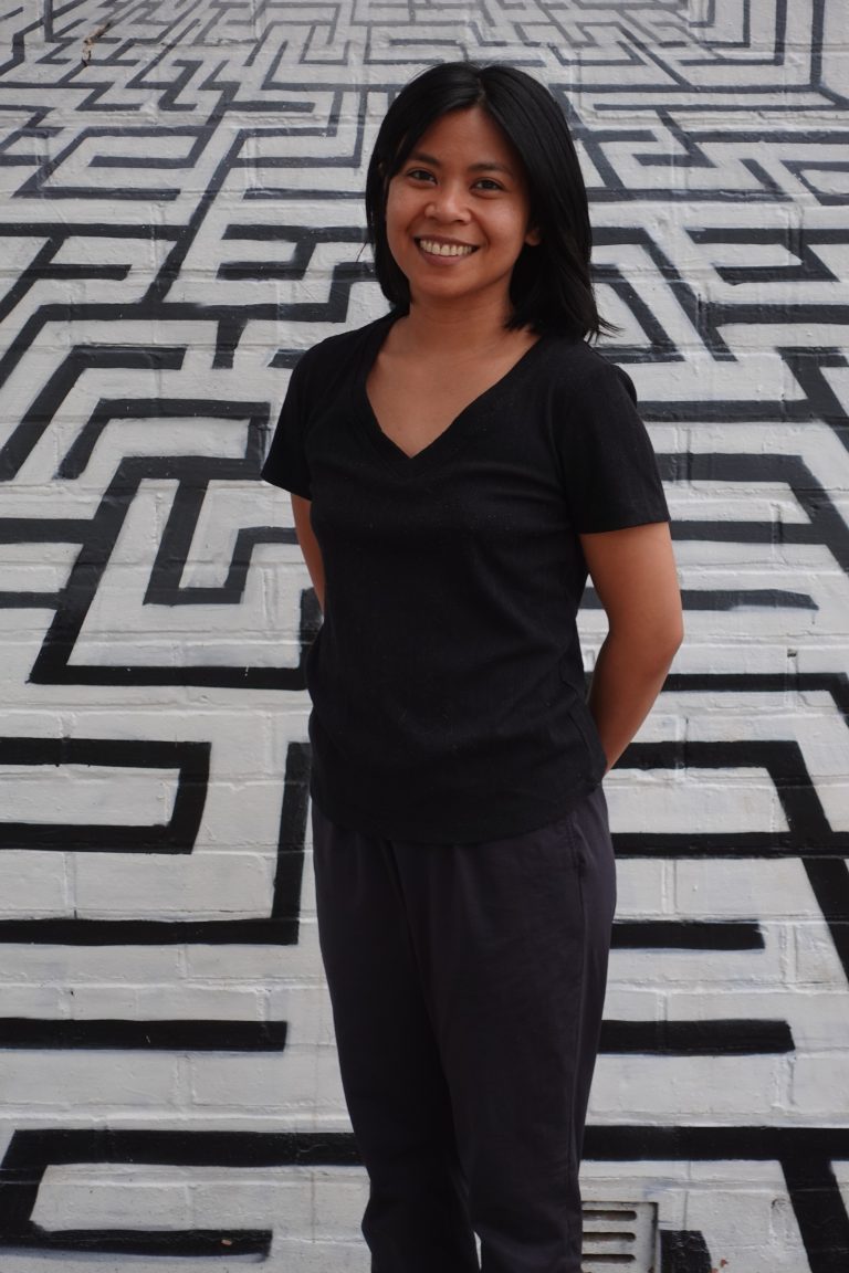 Diana Quinones, Occupational Therapist, smiling and standing outdoors in Adelaide